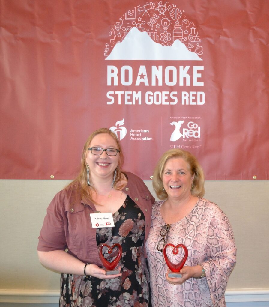 Ashley Sloan (left) and Amy White at the STEM Goes Red Executive Breakfast. Sloan, who is the lead STEAM instructor at the Virginia Tech Roanoke Center, is also one of White's former students.
