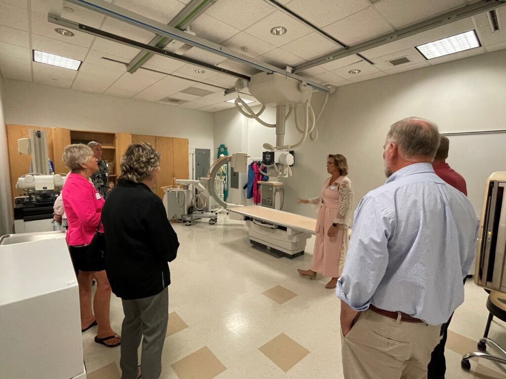 Radiography Program Head Susan Nolley shows alumni the program's laboratory space in the Fralin Center for Science and Health Professions.