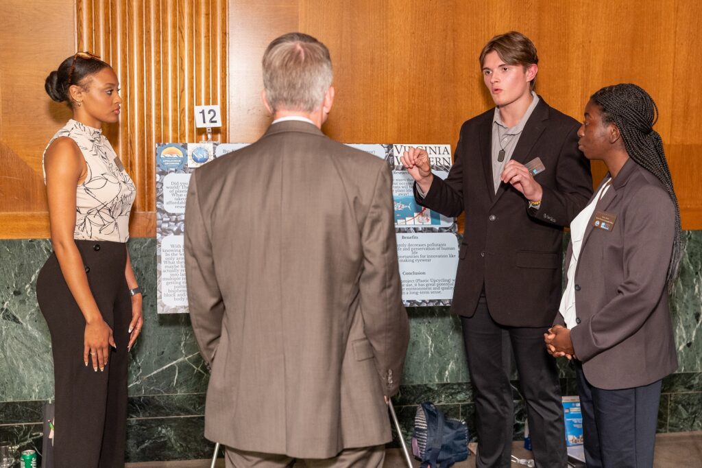 Erynn Martin, Joshua Hawks and Kiana Watt of Virginia Western's Team Plastic Up-Cycling share their idea with an expert panel of entrepreneurs. Courtesy of EPNAC.