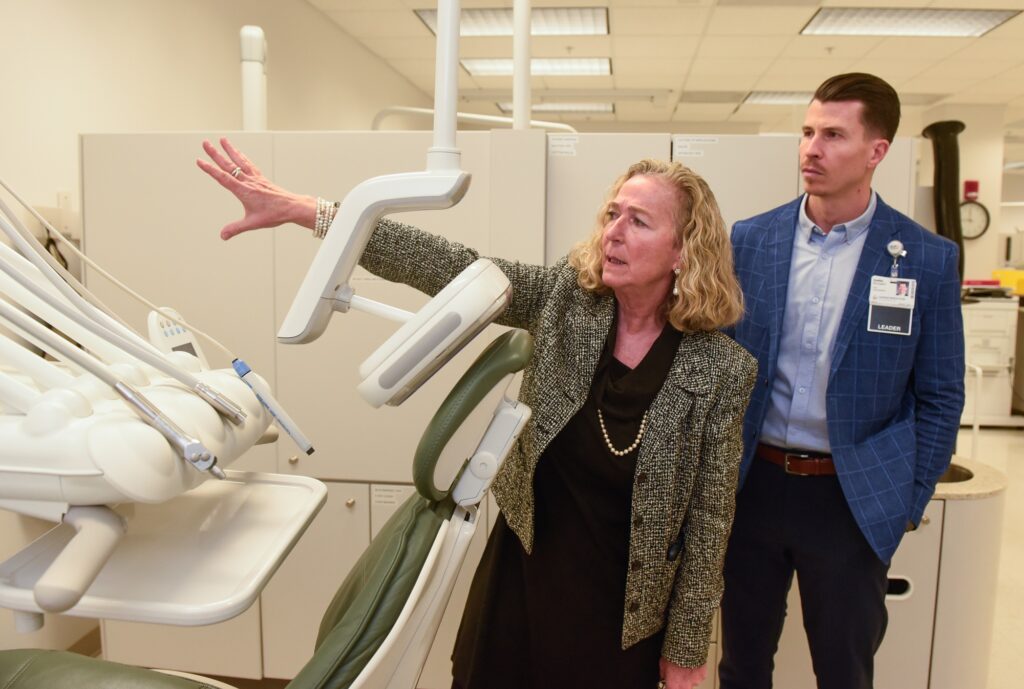 Marty Sullivan, Virginia Western Dean of Health Professions, shows the Dental Hygiene Clinic to officials including Collin McLaughlin, CEO, LewisGale Medical Center. Photo credit: Clem Britt, Virginia Community College System.