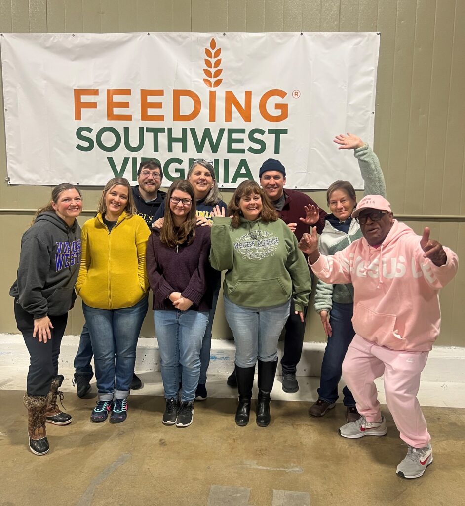 The afternoon shift of Virginia Western volunteers at Feeding Southwest Virginia, directed by James Andrews (front right) of the food bank.