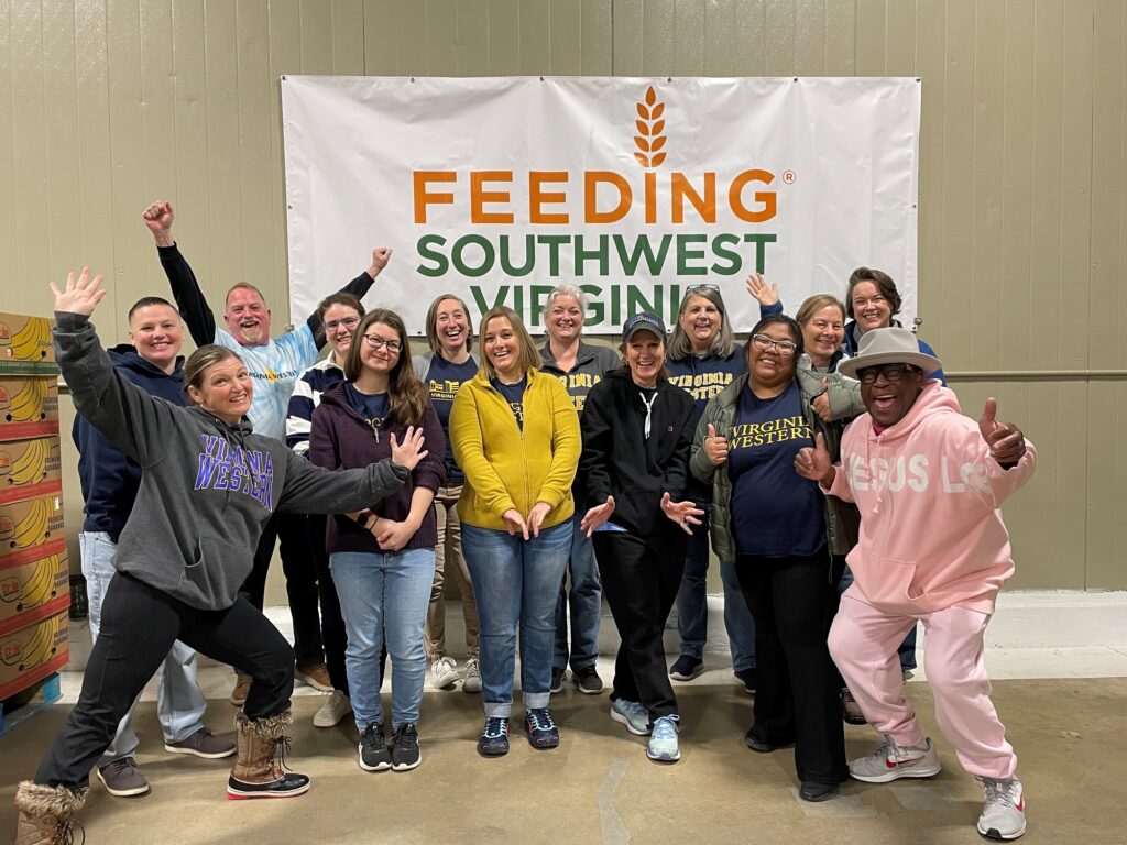 Volunteers from Virginia Western take the morning shift on the Day of Service, directed by Feeding Southwest Virginia staff member James Andrews (front right).