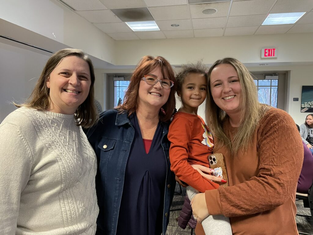 Dana Mabry (left) and Krystal Woods (right) enjoy catching up with Dr. Annemarie Carroll.