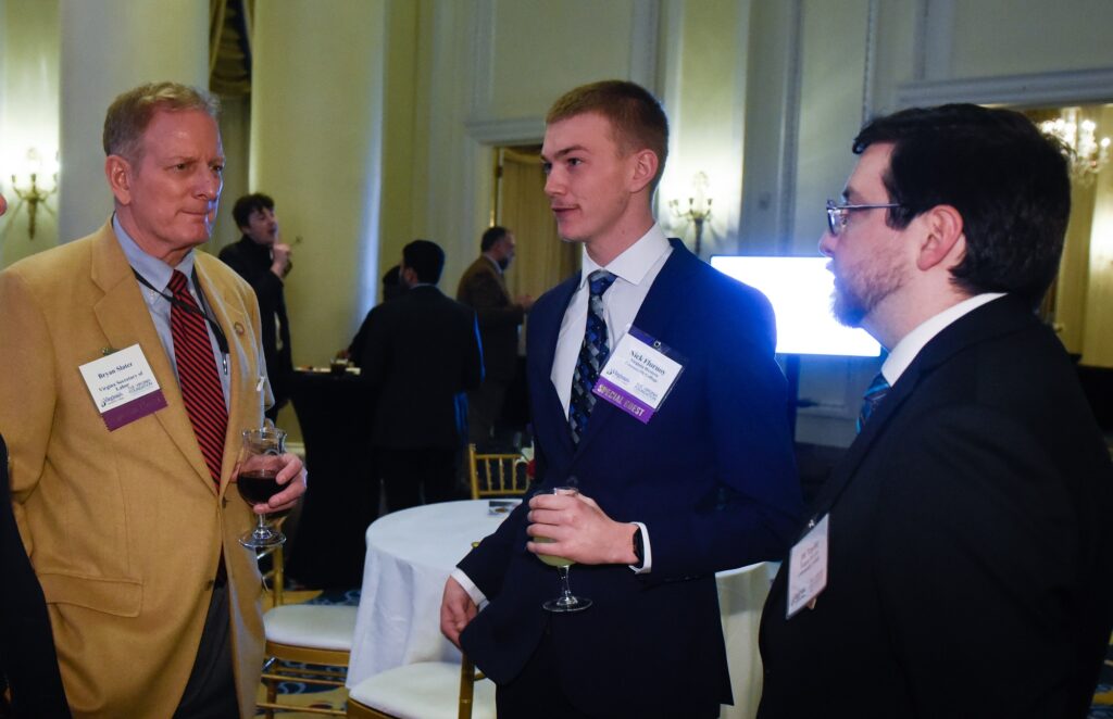 Virginia Secretary of Labor Bryan Slater (from left) talks with student speaker Nick Flurnoy and Great Expectations Success Coach JW Taylor at the Legislative Reception.