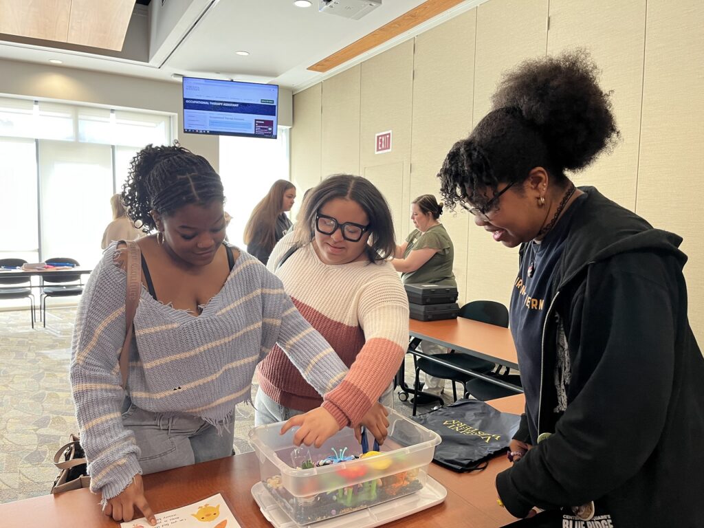 Healthcare students from Roanoke City Public Schools do activities at a station for the Occupational Therapy Assistant Program.